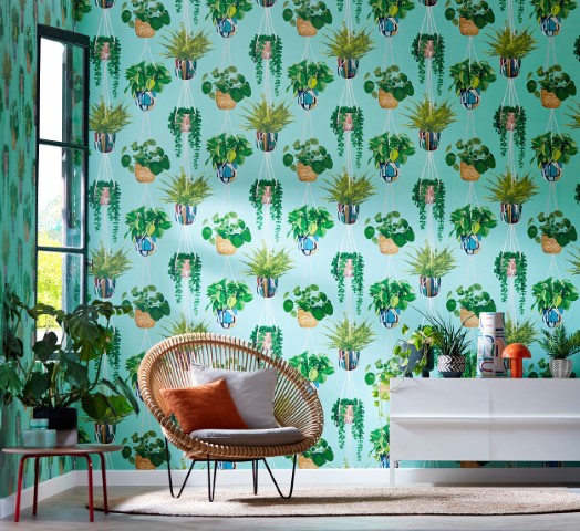 a roomset showing wallpaper with houseplant designs on it.