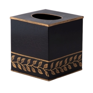 A black and gold tissue box Description automatically generated