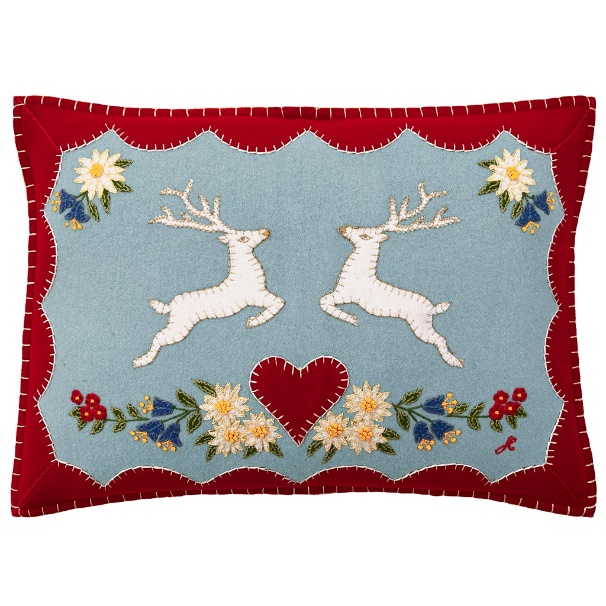 A pillow with deer and flowers

Description automatically generated