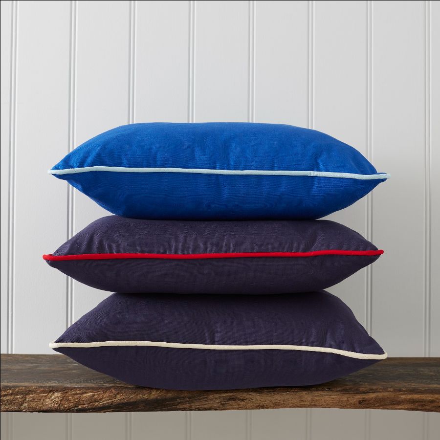 A stack of pillows on a table Description automatically generated